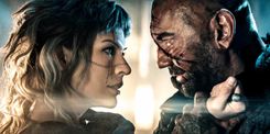 milla-jovovich-grabs-dave-bautista-in-image-for-in-the-lost-lands (1).jpg